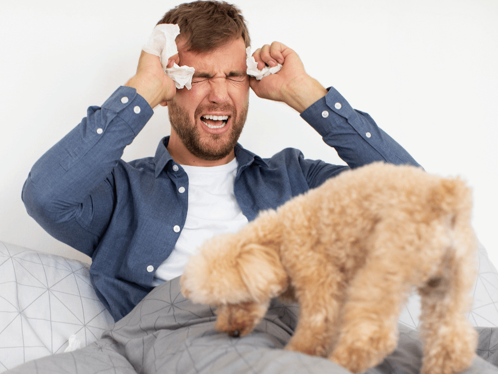 a man with a dog on his bed