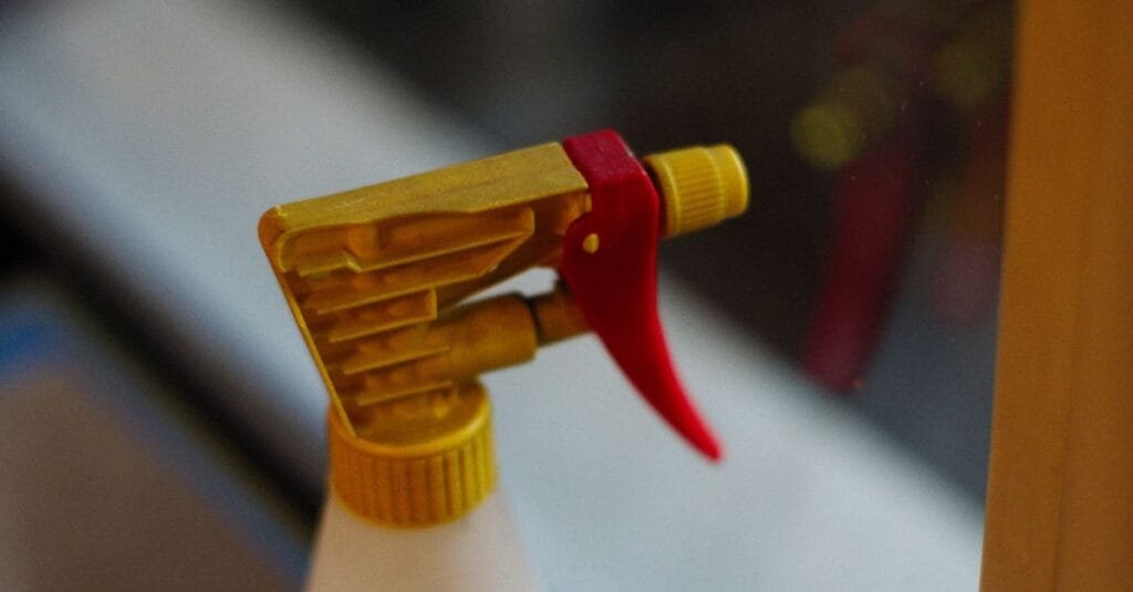 Yellow spray bottle nozzle in close-up